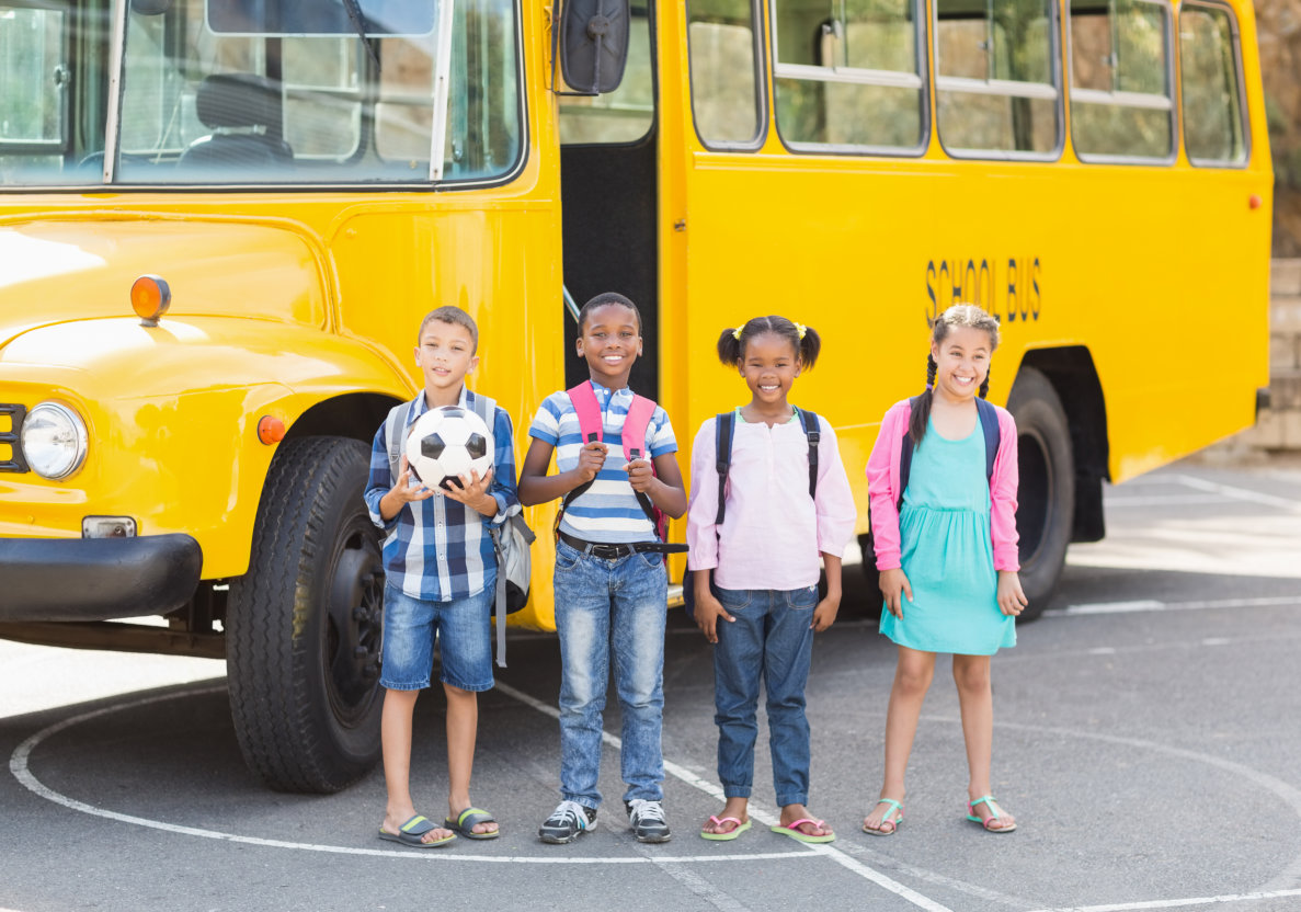 children outside the school bus